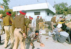 Suspended panchayat secretaries being lathicharged by the police in Patiala.