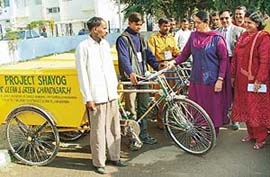 Mayor Lalit Joshi hands over 12 specially designed rickshaws  for garbage collection in Sector 15, Chandigarh, on Saturday.