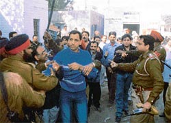 Police personnel use force to disperse supporters of Jagdish Tangri
