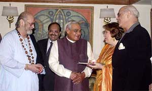 Prime Minister Atal Behari Vajpayee receives a copy of ��Raj Kapoor speaks�� from author Ritu Nanda