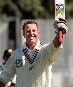 New Zealand�s Mark Richardson salutes the crowd after the ten-wicket defeat of India on the third day of the first cricket Test