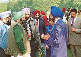 Capt Amarinder Singh, Chief Minister of Punjab, relaxes with members of the Chandigarh Golf Club after casting his vote in the annual election of the club on Sunday