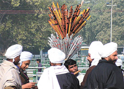 A flutist striking up a tune for his supper at the India Gate