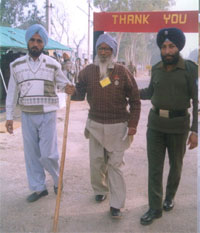 Mr Kehar Singh, a retired jawan, being helped by Army personnel to reach the venue for a function