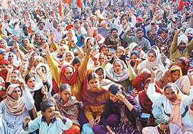 Workers of the Punjab State Committee of the Centre of Indian Trade Unions stage a dharna 