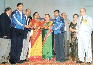 The Deputy Director of Education (West District), Ms Daljeet Kaur giving away the prizes