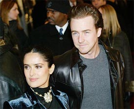 Actor Ed Norton and his girlfriend Salma Hayek pose for photographers