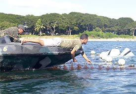 Filipino solders retrieve the wreckages of a military inter-island aircraft
