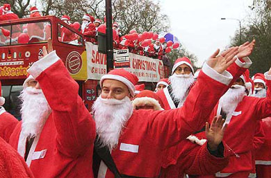 Around 200 men dressed as Santa Claus prepare to board a bus