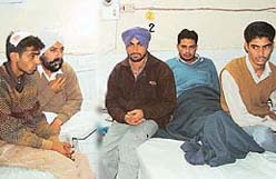 Four men, who were attacked by armed persons in Lohgarh village near Zirakpur late on Wednesday, receive treatment in Civil Hospital, Dera Bassi