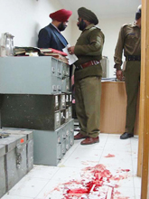 The police investigates at the Lakhdata Bazar branch of Jammu and Kashmir Bank 