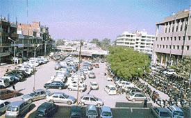 Cars parked in the Feroze Gandhi Market complex, most of which belong to car dealers