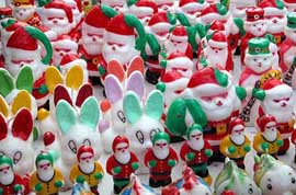 A candle store filled with wax Santas