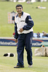 Indian cricket captain Sourav Ganguly laughs as he checks the pitch before play was abandoned due to rain