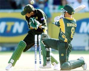 South African batsman Jonty Rhodes is bowled by Pakistan's Saqlain Mushtaq