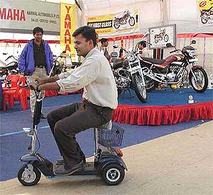 A battery-operated mini scooter on display