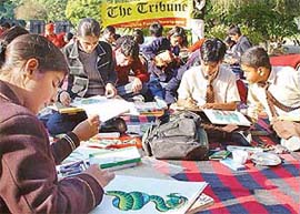 Schoolchildren participate in a painting contest, Chitrakala, at Government Museum and Art Gallery