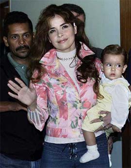 Mexican pop singer Gloria Trevi waves to photographers