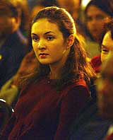 A young girl attends Christmas celebrations