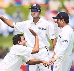 Zaheer Khan celebrates with team-mates after running out Daryl Tuffey for 13 runs in their second and final Test at Westpac Park in Hamilton on Saturday.