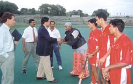 Mr Michael Mascarenhas, former managing director of Air-India, honouring Indian goalkeeper Devesh Chauhan