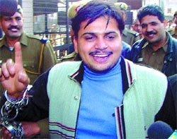 Ashok Singh Malik, accused in the murder of Reader M. N. Singh, being produced in Tis Hazari courts