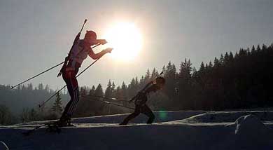 Sillhouetted Ekaterina Dafovska of Bulgaria is closely followed by the second placed Galina Dafovsk