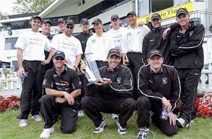 New Zealand players gather for a group photo with the Test trophy after their victory on day four of the second cricket Test