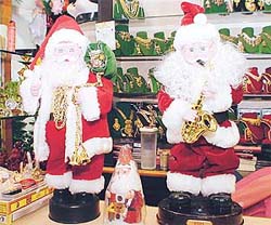 Dancing and singing Santas. 