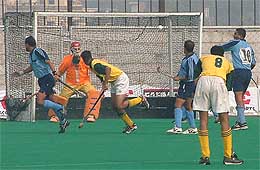 Rajinder Bansal of England Gymkhana scoops the ball into the net 