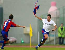 Bologna's Christian Zaccardo celebrates with teammate Marcello Castellini after scoring against Lazio