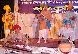 Artistes perform during a cultural programme