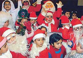 Children of Strawberry Club dressed as Santa Claus at a Christmas function, in Ludhiana 