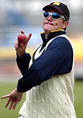 Australian Stuart MacGill prepares to bowl during a net practice session