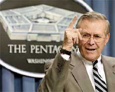 US Secretary of Defense Donald Rumsfeld gestures while speaking to the Press