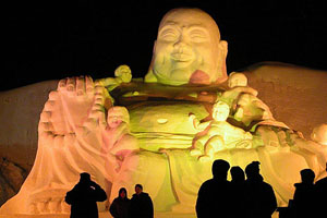 Visitors take photos of an ice sculpture