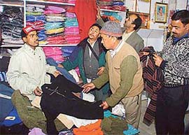 Tibetan traders make hosiery purchases from a Ludhiana market after the cold wave gripped the region