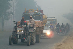 Vehicles move at a snail�s pace with headlights on
