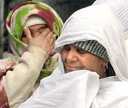 Relatives mourn the death of three girls