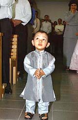 A young devotee attends Christmas mass