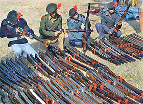 NCC cadets inspect their rifles on the eve of their departure for New Delhi to attend the Republic Day Camp 