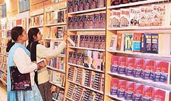 Visitors browse through books at a book exhibition 