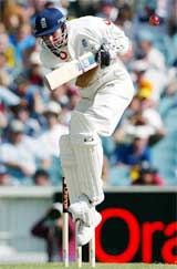 England's Michael Vaughan ducks under a bouncer from Australia's Brett Lee during the third day's play in the fourth Test in Melbourne on