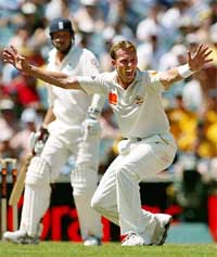 England's Robert Key watches as Australia's Brett Lee celebrates taking his wicket