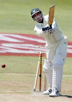 Pakistan captain Waqar Younis is bowled by South African Mornantau Hayward