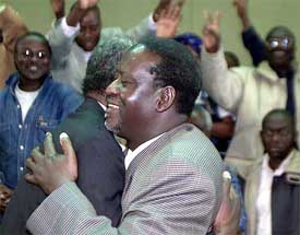 NARC official Raila Odinga embraces a supporter