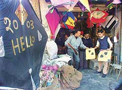 A seller in Ludhiana displays a 4x4 feet kite with New Year greetings
