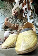 Shoemaker Darshan Singh, 48, makes a "Punjabi Khusa"