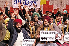 Unemployed Linemen�s Union representatives sit on dharna outside the PSEB headquarters building