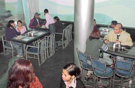 Friends enjoy a gourmet meal at Piccadily�s Blue-Ice, Sector 17